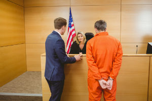 Lawyer with his client in front of judge