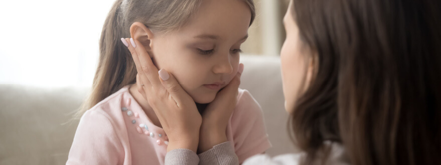 mother consoling her daughter during child custody hearing