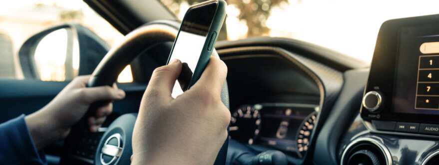 person texting while driving