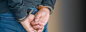person in handcuffs