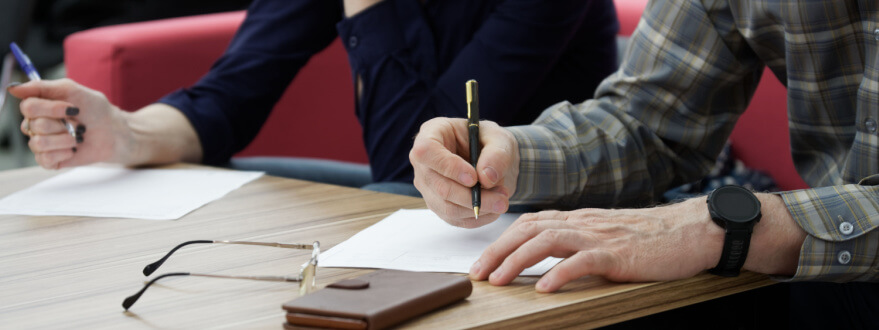 couple signing agreements for property division