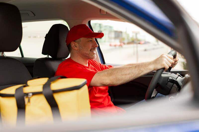 Doordash driver delivering food.