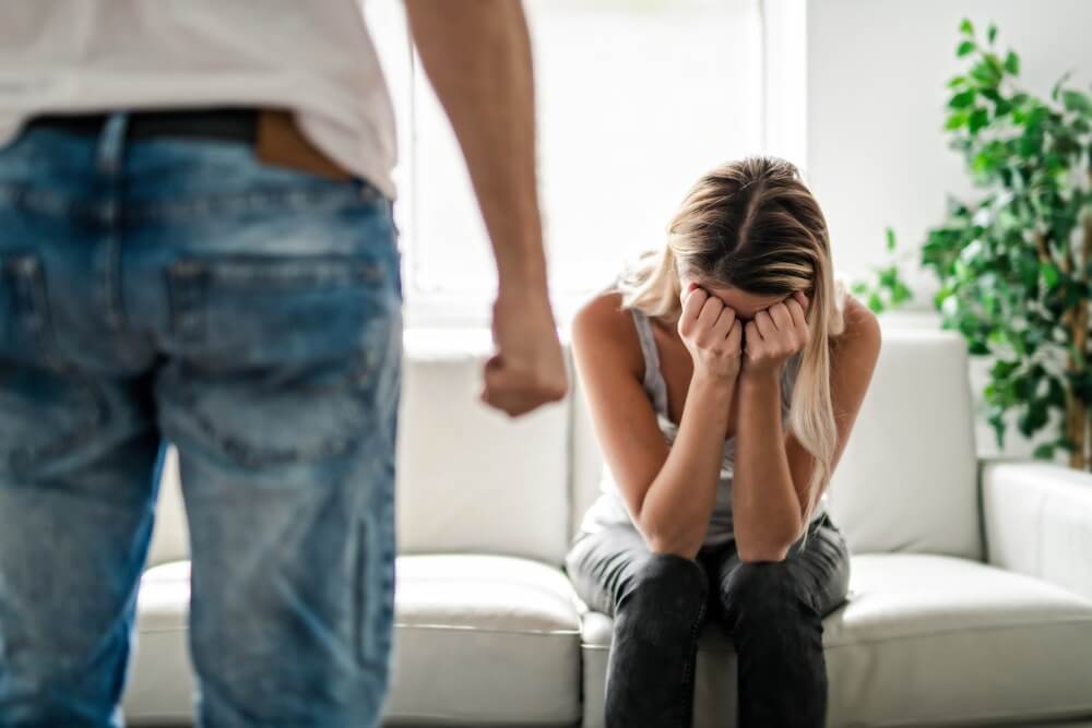 Man beating up his wife illustrating physical cruelty.